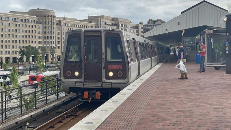 A North bound Yellow Line train is arriving in King St Old Town Station.
